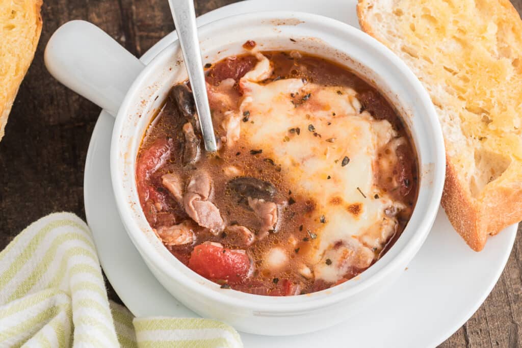 Soup in the white bowl.