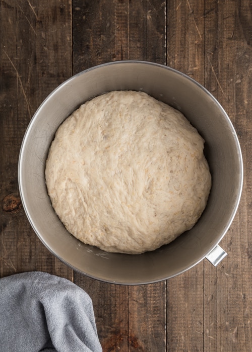 The dough after risen in the mixing bowl.