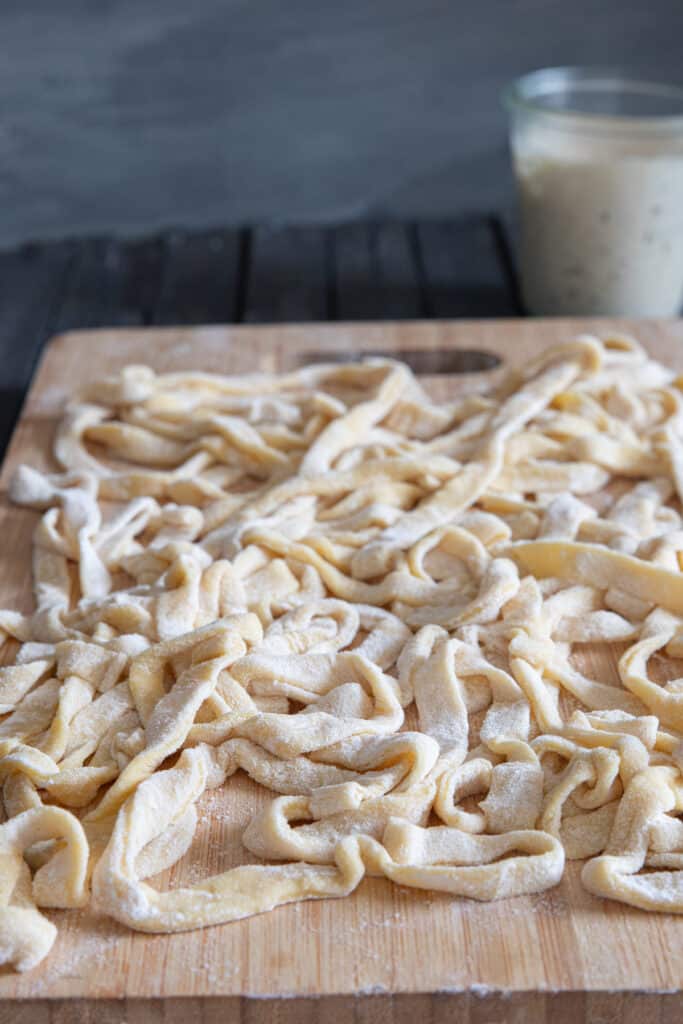Fresh pasta on a wooden board.