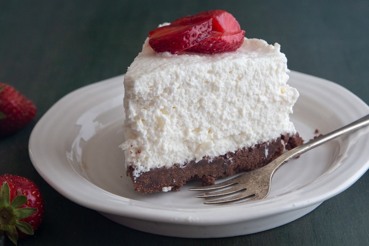 Ricotta cheesecake on a white plate.