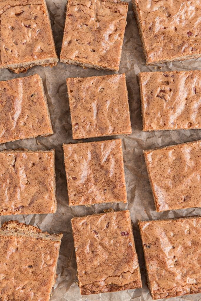 Cut blondies on parchment paper.