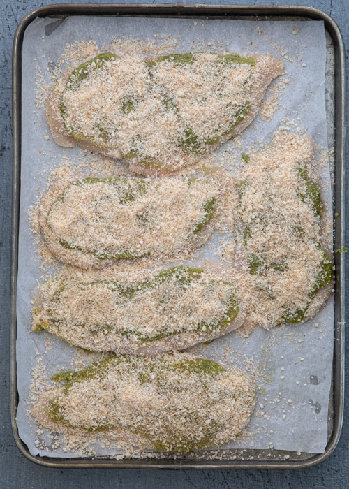The chicken before baked on the baking sheet.