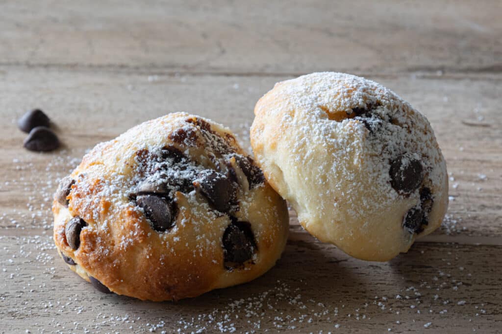 Two cookies on a board.