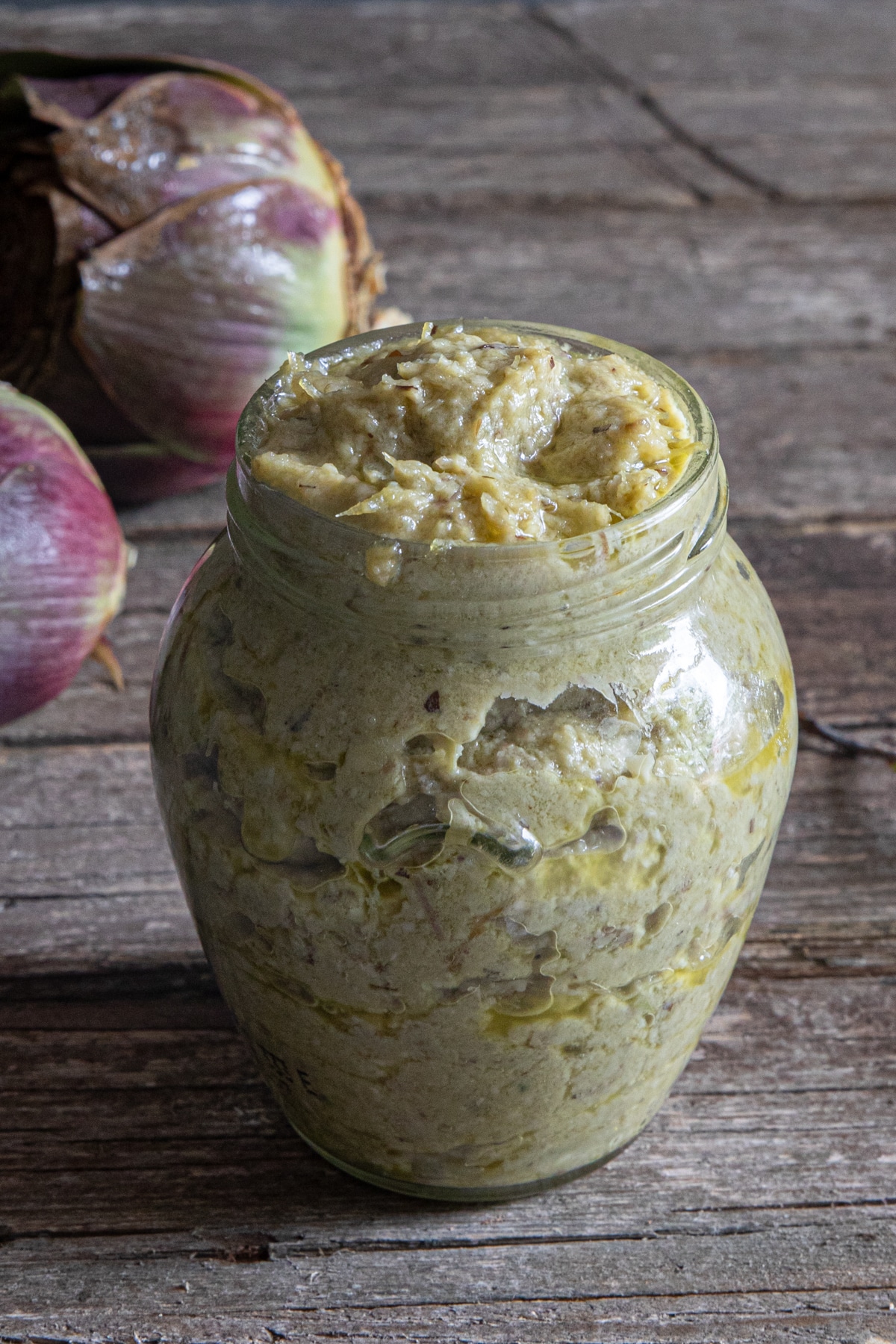 Artichoke pesto in a glass jar.