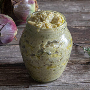 Artichoke pesto in a glass jar.