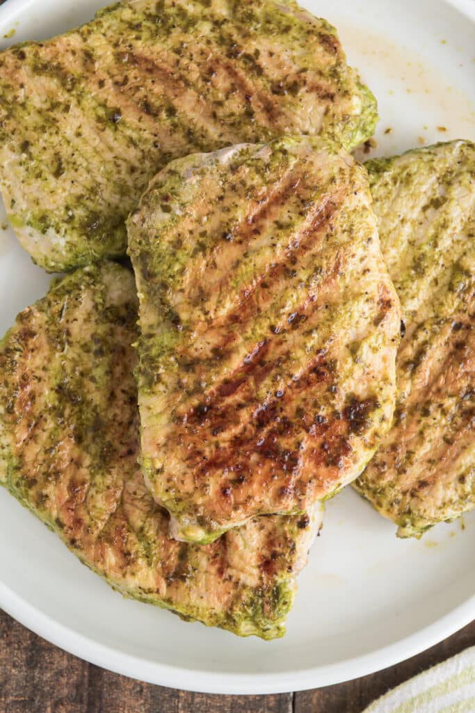 Pork chops on a plate.