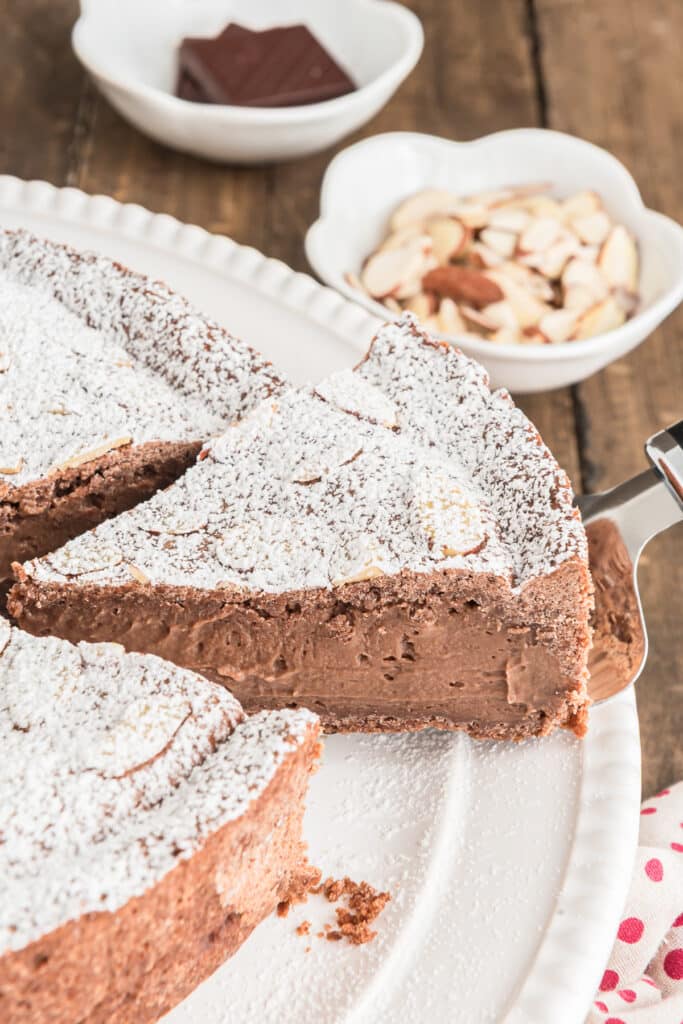 Nonno cake on a white plate with a slice cut.