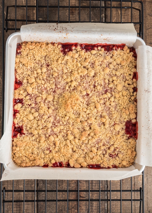 The baked strawberry crumb bars in the pan.