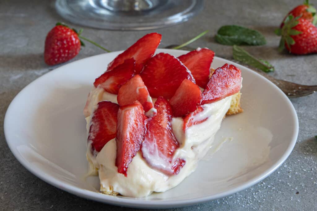 A slice of the crostata on a white plate.