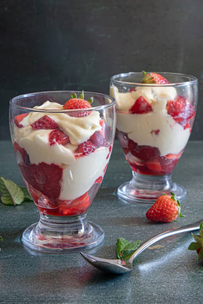 Leftover pastry cream and strawberries in two glasses.