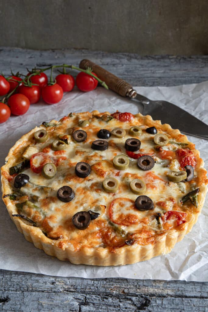 Savory vegetable pie on parchment paper.
