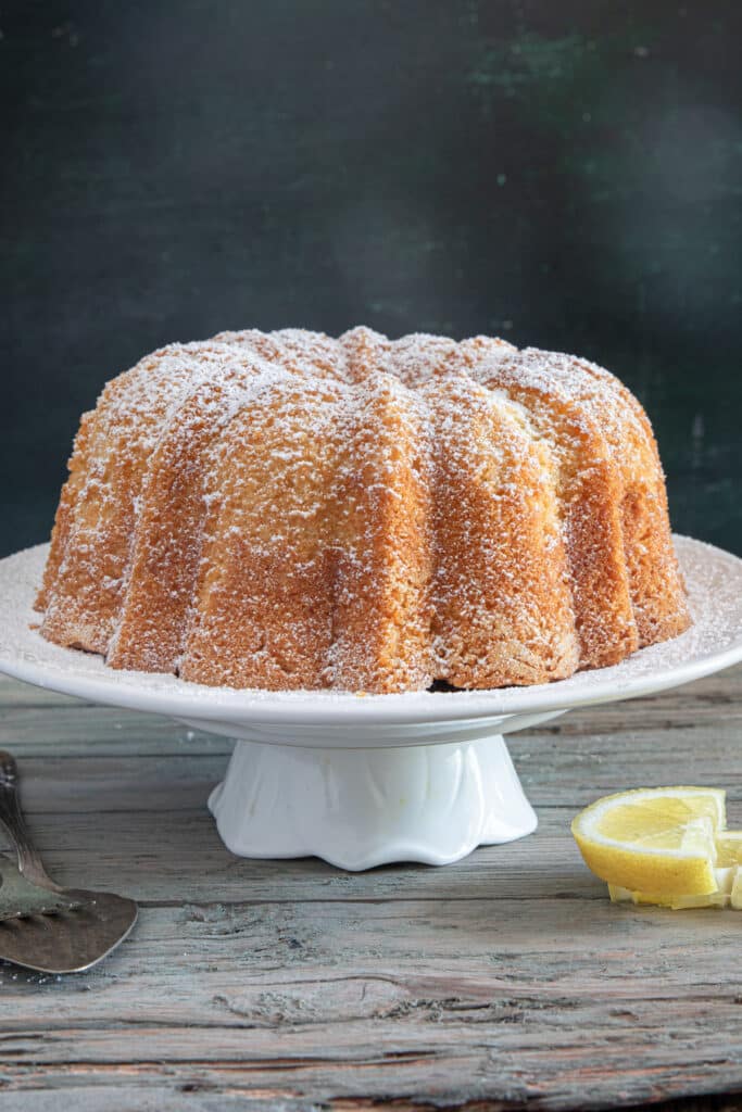 The cake on a cake plate.