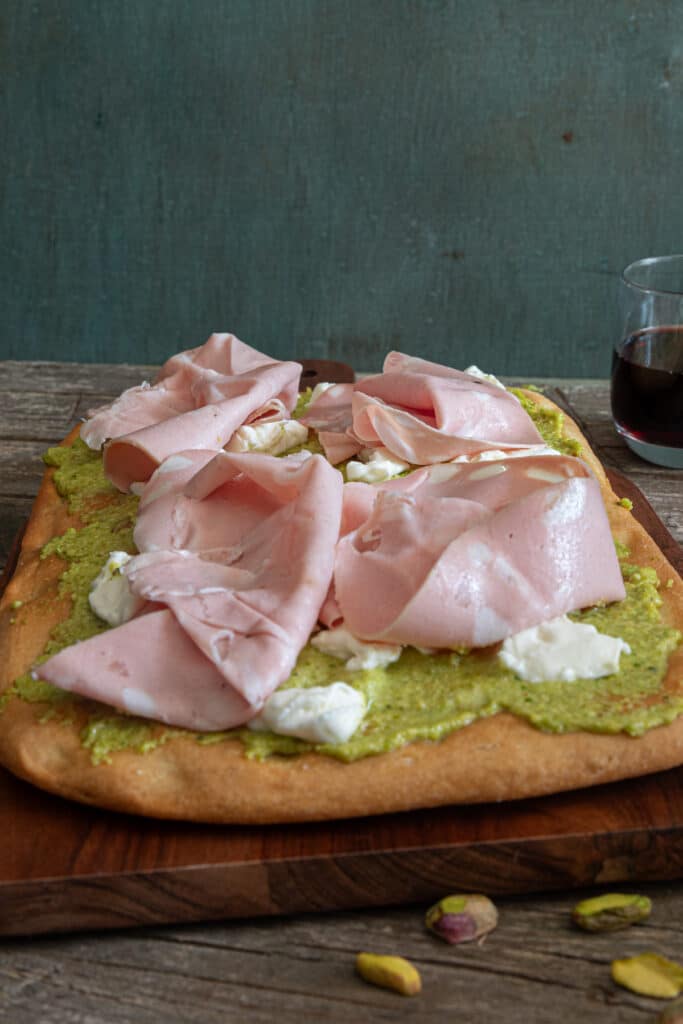 Schiacciata with pesto, stracchino and mortadella.