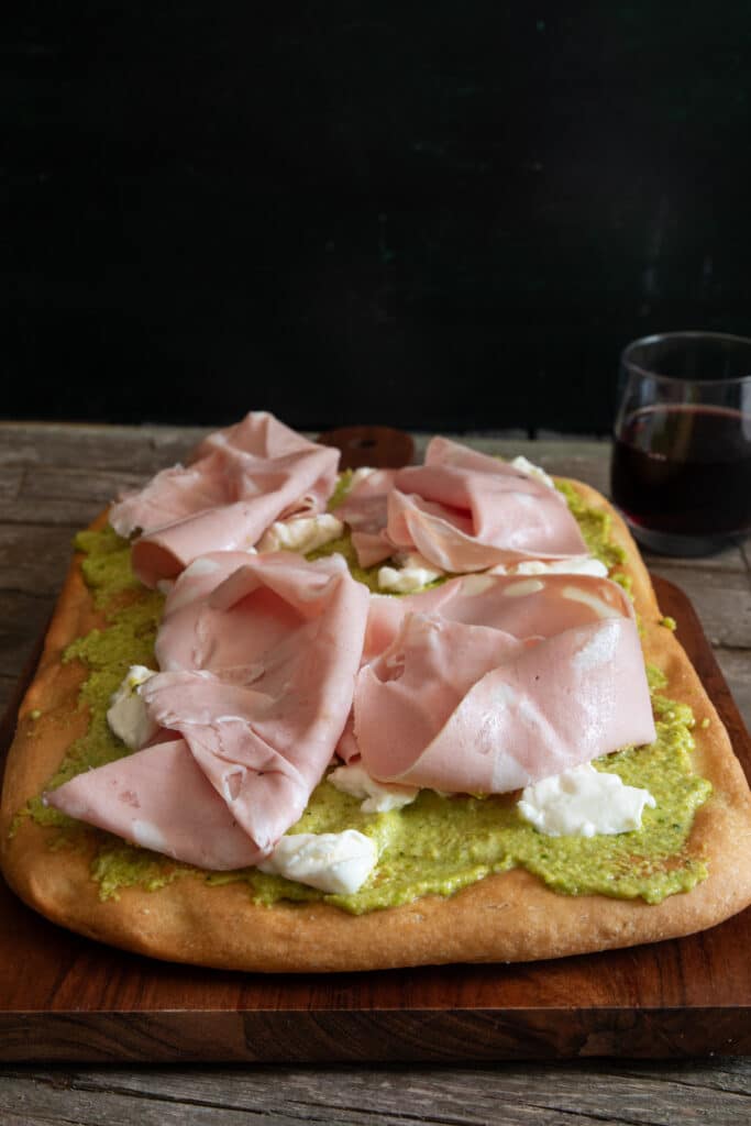 Schiacciata with pesto, stracchino and mortadella.