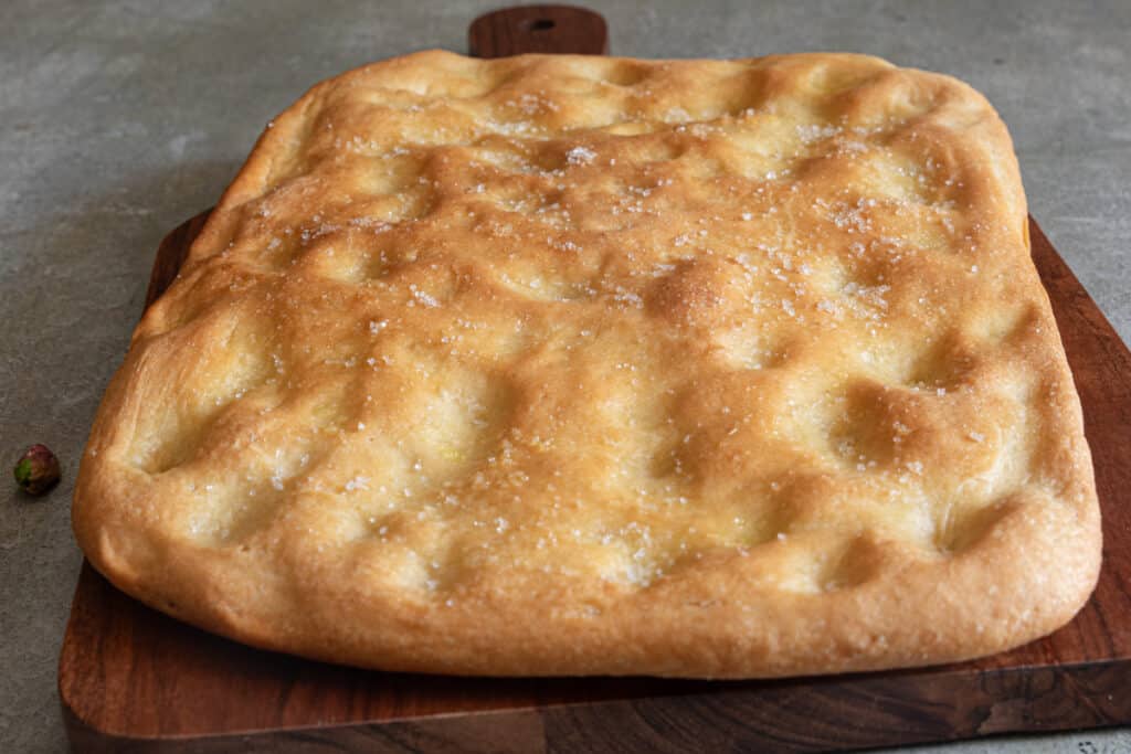 Schiacciata on a wooden board.