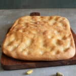 Schiacciata on a wooden board.