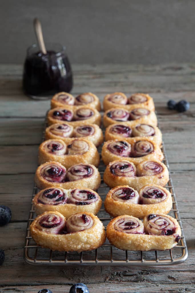 The baked palmiers on a wire rack.