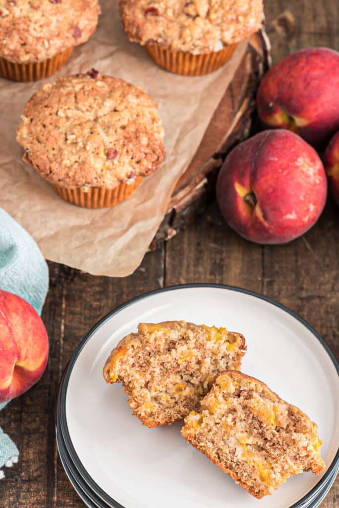 Muffins on a board and one cut in half.
