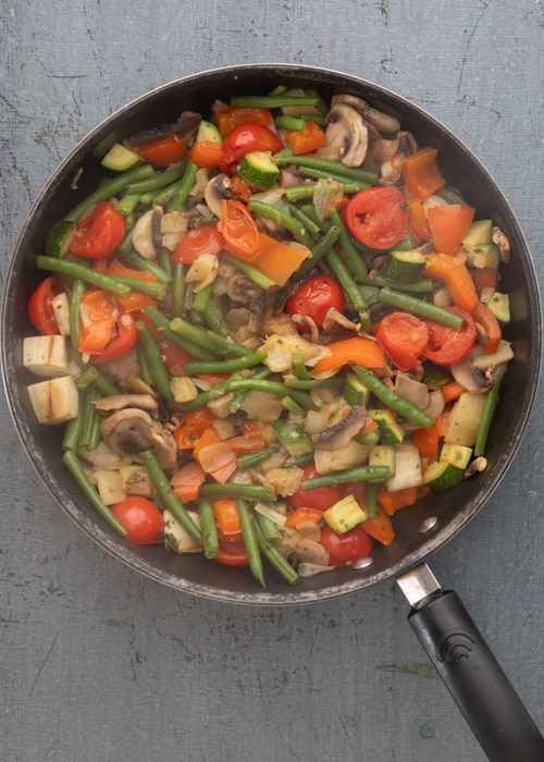 The vegetables cooked in the pan.