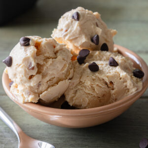 Three scoops of ice cream in a bowl.