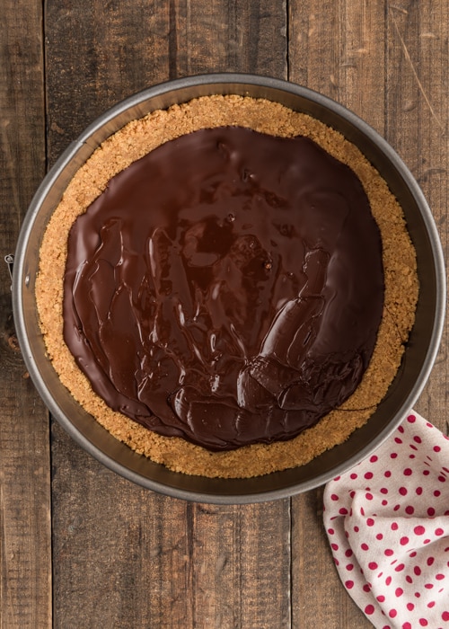 Melted chocolate on the base in the pan.