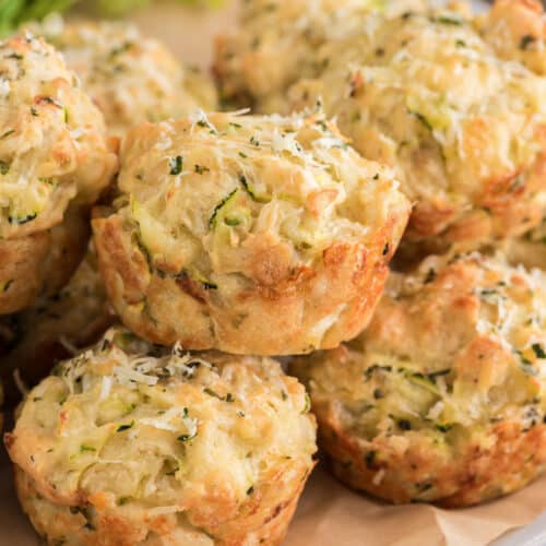 Zucchini muffins on a board.