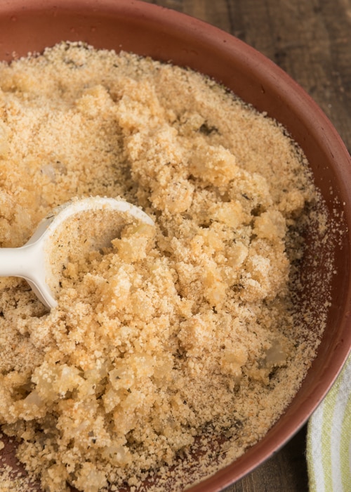 Mixing the bread crumbs in a bowl.