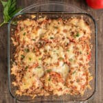 Tomato casserole in a glass pan.