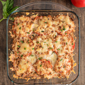 Tomato casserole in a glass pan.