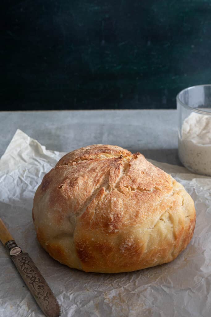 The bread on parchment paper.