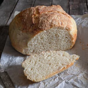 The bread with a slice cut.