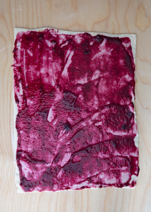 The jam spread on the dough.