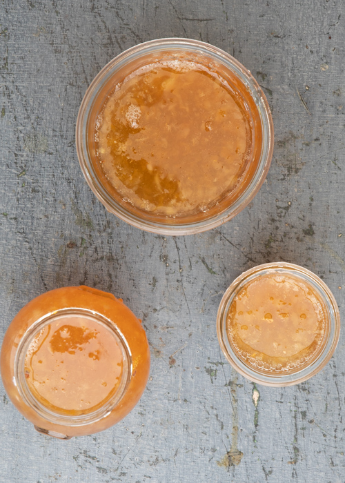 The marmalade in the jars.