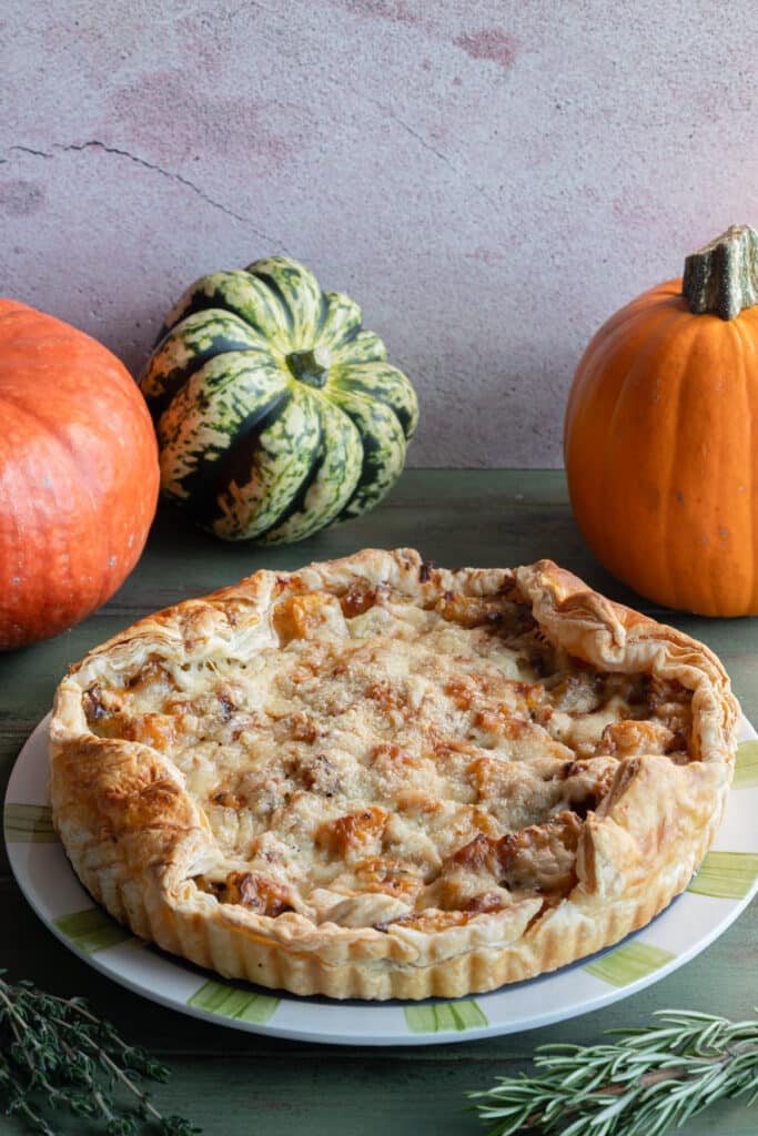Pumpkin tart on a white plate.