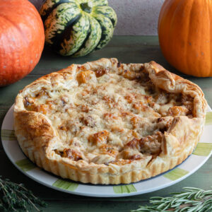 Pumpkin tart on a white plate.