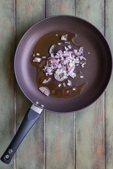 Cooking the onions in the pan.